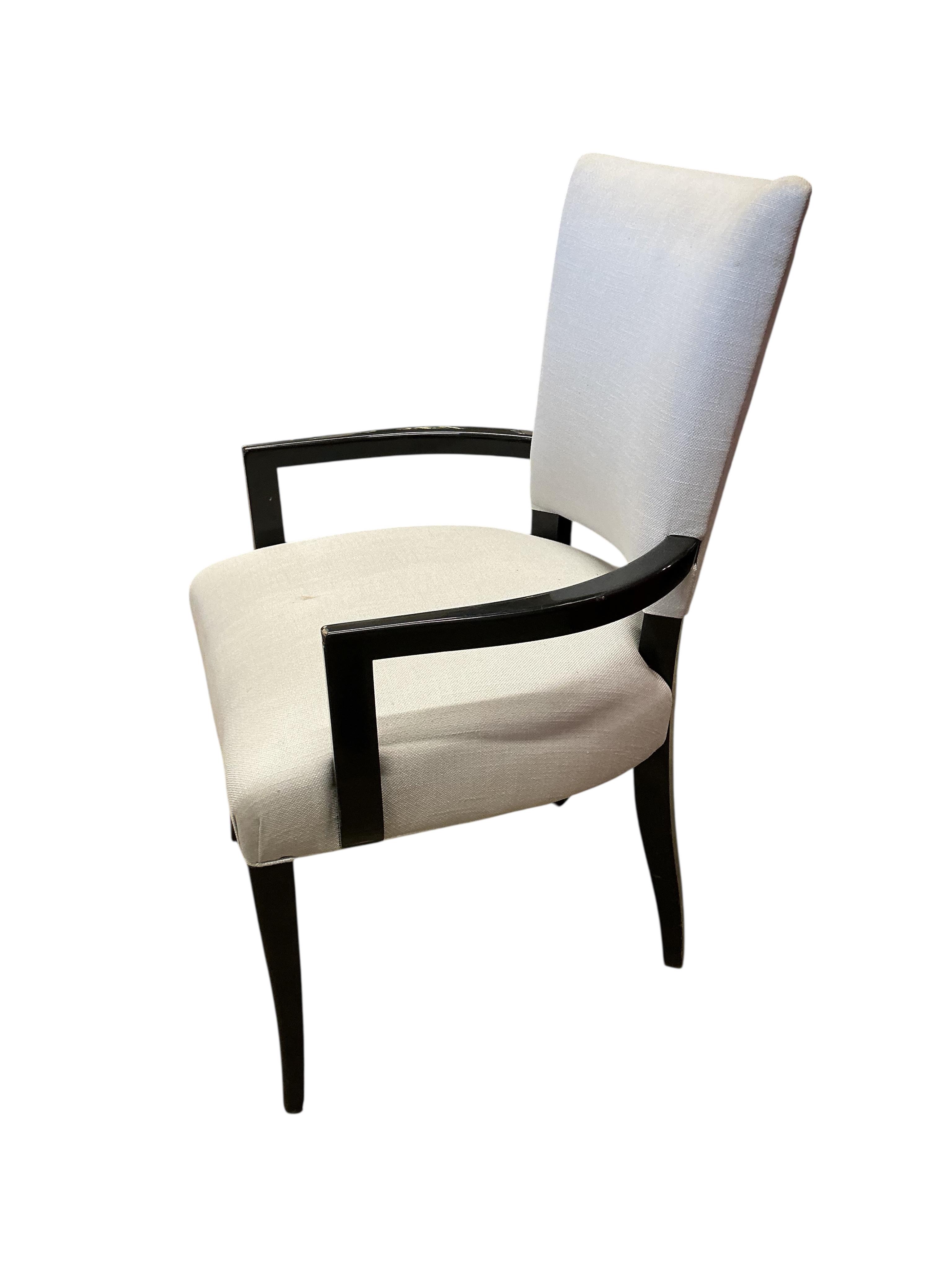 Seven contemporary ebonised and grey fabric elbow chairs, five with arms